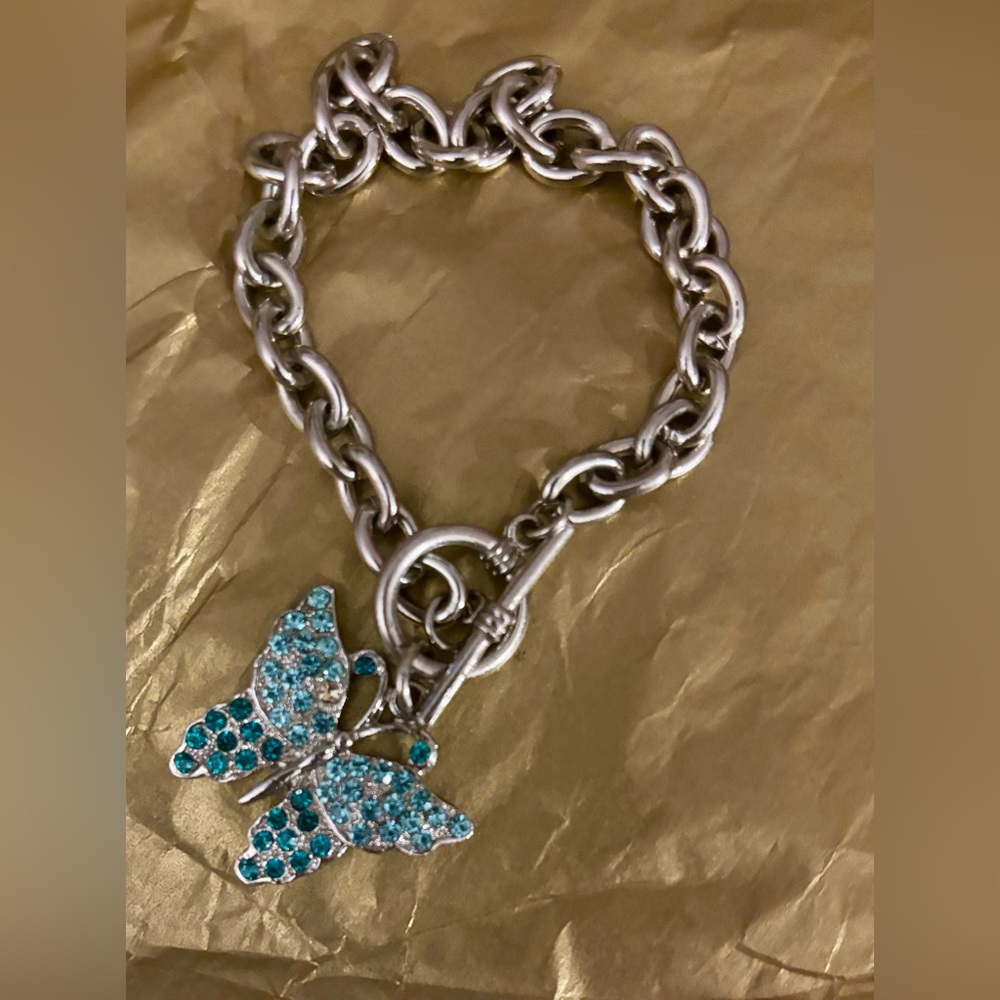 Silver tone butterfly bracelet.